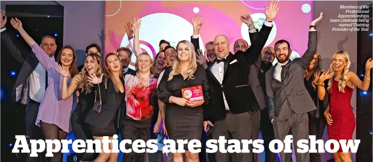  ?? ?? Members of the Profession­al Apprentice­ships team celebrate being named Training Provider of the Year