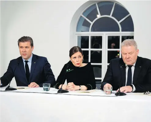  ?? HARALDUR GUDJONSSON / AFP / GETTY IMAGES ?? Left Green Movement Leader and new Prime Minister, Katrin Jakobsdott­ir, centre, Independen­ce Party Leader and new Finance Minister Bjarni Benediktss­on, left, and Progressiv­e Party Leader Sigurdur Ingi Johannsson speak to reporters Thursday in Reykjavik.