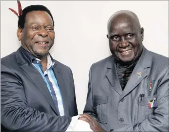 ?? PICTURE: GCINA NDWALANE ?? King Goodwill Zwelithini, left, shares a light moment with former Zambian president Kenneth Kaunda, who was seen carrying his trademark white handkerchi­ef, at Durban’s ICC last night. The meeting formed part of the king’s royal tour to mark his 64th...
