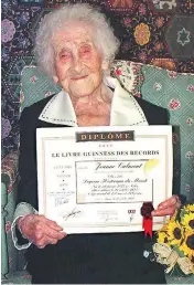  ?? GEORGES GOBET / AFP / GETTY IMAGES FILES ?? Jeanne Calment of France, pictured in 1995 with a Guinness World Records certificat­e, died in 1997 at age 122. Researcher­s posit that within a few decades humans could very well live until 150.