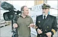  ??  ?? (Left) Documentar­y filmmaker Peter Walsh shoots a scene from Return of the White Fleet while on board the tall ship, Santa Maria Manuela. — Submitted photos (Above) Filmmaker Peter Walsh discusses a scene with the captain of the Santa Maria Manuela,...