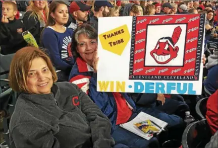  ?? DAVID S. GLASIER — THE NEWS-HERALD ?? Indians fans Patti DeRosa, left, and Marti Slepecki watch the game at Progressiv­e Field on Sept. 30