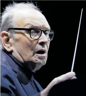  ?? Photo / AP ?? Italian composer Ennio Morricone directs an ensemble during a 2018 concert on his “60 Years of Music world tour”, in Milan, Italy.