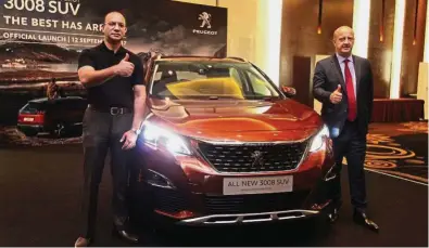  ??  ?? New model: Yasser (left) and Faugeres at the launch of the all-new Peugeot 3008 SUV in Shah Alam.