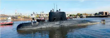  ?? (Reuters) ?? THE ARGENTINE military submarine ‘ARA San Juan’ and crew are seen leaving the port of Buenos Aires in 2014.