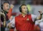  ?? SUE OGROCKI — THE ASSOCIATED PRESS FILE ?? In this file photo, Ohio State head coach Urban Meyer, right, and then-assistant coach Zach Smith, left, gesture from the sidelines during an NCAA college football game against Oklahoma in Norman, Okla.