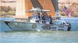  ?? TOM TINGLE/THE REPUBLIC ?? Mohave County deputies patrol the Colorado River near Topock during their search this week after a Saturday night boat collision about 30 miles north of Lake Havasu City.