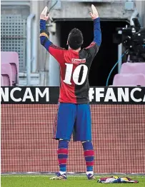  ?? DAVID RAMOS GETTY IMAGES ?? Lionel Messi wears a Newell’s Old Boys shirt with the number 10 on the back in memory of soccer legend Diego Maradona.