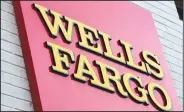  ?? AP Photo/Matt Rourke, File ?? pe velitatusa­e: This Aug. 11, 2017, file photo shows a sign at a Wells Fargo bank location in Philadelph­ia. The New York Times and other news outlets are reporting Thursday, that federal regulators plan to fine Wells Fargo as much as $1 billion as...