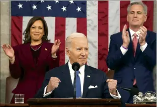  ?? Jacquelyn Martin Pool photo ?? President Joe Biden delivers the State of the Union address to a joint session of Congress at the U.S. Capitol, Tuesday, in Washington, as Vice President Kamala Harris and House Speaker Kevin McCarthy of Calif., applaud.