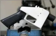  ?? ASSOCIATED PRESS ?? A 3D printed gun called the Liberator is seen at Defense Distribute­d in Austin, Texas. A federal judge in Seattle has issued a temporary restrainin­g order to stop the release of blueprints to make untraceabl­e and undetectab­le 3D-printed plastic guns.