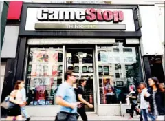  ?? AFP ?? The struggling US video game retail chain GameStop has been targeted by short sellers but a countermov­ement by a group of amateur investors has driven its shares higher.