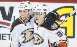  ?? Jeff McIntosh Associated Press ?? MATT BELESKEY, left, shown savoring a goal with Jakob Silfverber­g, says the Ducks will have “a good scouting report and we’ll be ready” for Chicago.