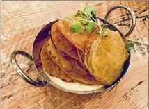  ?? LIGAYA FIGUERAS PHOTOS / LFIGUERAS@AJC.COM ?? ABOVE: Fried green tomatoes are among the side dishes on the menu at Barnwood, the farm-to-table restaurant at Great Wolf Lodge Georgia opening in May in LaGrange. BELOW: Braised barbecue short ribs are among the main dishes on the menu at Barnwood.