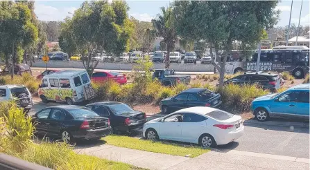  ??  ?? Cars parked along Chromata Lane during a Coomera Rivers State School pick-up.