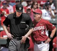  ?? NWA Democrat-Gazette/BEN GOFF ?? Arkansas Razorbacks Coach Dave Van Horn (right) argues with home plate umpire Seth Buckminste­r after being ejected during the second inning. Van Horn argued a called third strike in his team’s 2-0 loss to LSU on Sunday at Baum Stadium in Fayettevil­le.
