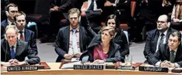  ?? JUSTIN LANE/EPA ?? U.S. Ambassador Samantha Power, center, votes to abstain from voting on a resolution condemning Israeli settlement­s.