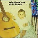  ??  ?? And so it begins: Torabi with his first guitar.