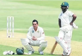  ?? /Lee Warren/Gallo Images ?? Long wait: Quinton de Kock and Temba Bavuma wait on the TV umpire’s decision which resulted in Bavuma being run out after a De Kock drive ricocheted off bowler Vishwa Fernando’s boot and on to the stumps.