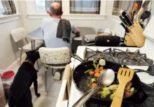  ??  ?? Above: Part of Christian Hainds’ carb-free meal remains on a cooking pan as he eats his dinner.