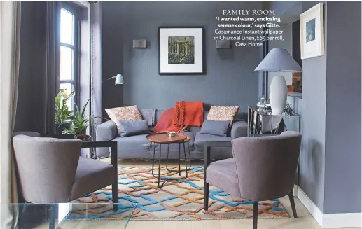  ??  ?? Family room ‘I wanted warm, enclosing, serene colour,’ says Gitte. Casamance Instant wallpaper in Charcoal Linen, £65 per roll, Casa Home