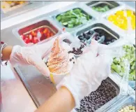  ?? AP PHOTO ?? A cup of strawberry vegan soft serve is prepared at Chloe’s Soft Serve Fruit Co., in New York.