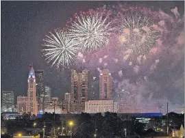  ?? [BROOKE LAVALLEY/DISPATCH] ?? The fireworks exploding over Downtown were captured vividly from a parking garage at Mount Carmel West.