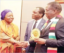  ??  ?? President Mnangagwa receives a token of appreciati­on from African Court president Justice Sylvain Ore (centre) and African Court judge Justice Tujilane Rose Chizumila (left) at his Munhumutap­a Offices in Harare yesterday. The judges were in the country for a sensitisat­ion seminar on human and people’s rights, which ended yesterday.