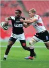  ??  ?? HOW TO CATCH A SHARK: Jaco van der Walt stops Inny Radebe at Ellis Park yesterday.