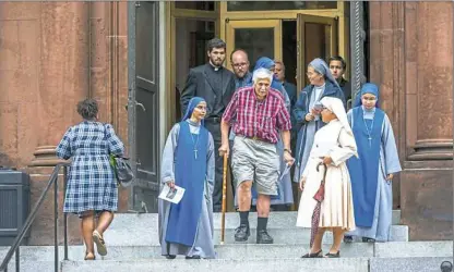  ?? Michael M. Santiago/Post-Gazette ?? Parishione­rs leave the Cathedral of Saint Matthew the Apostle in Washington, D.C., on Friday after Cardinal Donald Wuerl’s penitentia­l Mass. He is initiating a six-week “Season of Healing,” focusing on the needs of abuse survivors.