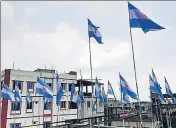  ?? AFP ?? Argentina flags installed on a rooftop on the outskirts of Dhaka.