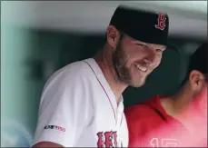  ?? CHARLES KRUPA ?? Boston Red Sox starting pitcher Chris Sale smiles in the dugout after completing his outing during the sixth inning of a baseball game against the Toronto Blue Jays at Fenway Park in Boston, Thursday, July 18, 2019. Sale allowed no runs in six innings.