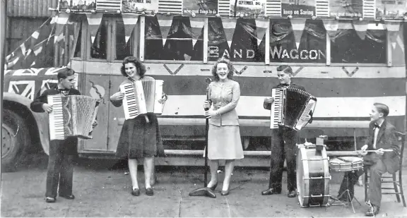  ??  ?? Musicians, from left, Robert Crighton, Mary Alexander (nee Penny), Bebe Richardson (nee Murray), Hamilton Scott and Tommy Mcdonald in front of a decorated Mclennan’s bus. Read more below right.