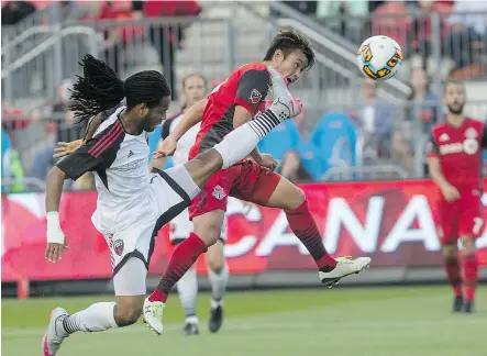  ?? CHRIS YOUNG / THE CANADIAN PRESS ?? Toronto FC’s Tsubasa Endoh, right, gets in front of Ottawa Fury’s Andrae Campbell to score his team’s second goal in the Canadian Championsh­ip semifinal second leg in Toronto on Wednesday.