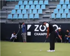  ??  ?? ELBOW ROOM: With the course closed to the public due to weather issues, Tiger Woods putts during the second round of the Zozo Championsh­ip in Inzai, Japan.