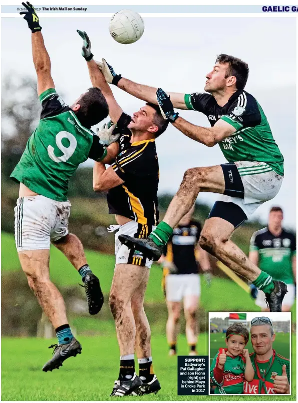  ??  ?? SUPPORT: Ballycroy’s Pat Gallagher and son Fionn (right) get behind Mayo in Croke Park in 2017