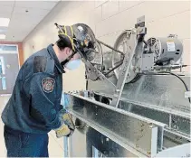  ?? SPECIAL TO TORSTAR ?? St. Catharines firefighte­r Chris Bartley, an elevator evacuation instructor, operates the fire department’s recently arrived elevator training equipment.