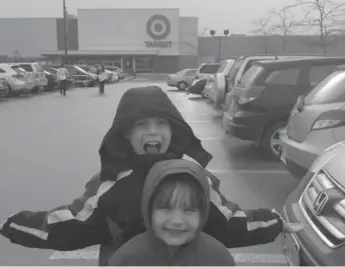  ?? LAURAL ADAMS ?? Matthew Adams, 9, and his sister Chloe, 5, were thrilled by Target’s store opening at Burlington’s Millcroft Shopping Centre. Chloe had so much fun she told her mother she wanted to have her birthday party in the store.