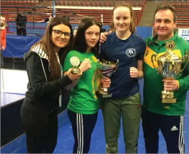  ??  ?? Gold medallists Daina Moorehouse and Abbie Doyle with coaches Paul O’Toole and Eve Carr.