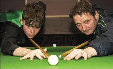  ?? Photo by John Reidy ?? Malta bound: Luke Regan pictured with his dad and mentor, Eddy, getting down to business ahead of this month’s European Pool Championsh­ips in Malta – for which Luke is launching a funding campaign.