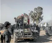  ?? PHOTO: GETTY IMAGES ?? Shia flags on Iraqi federal police humvees advancing into west Mosul, part of the offensive to retake the city some two years after it fell to Islamic State.