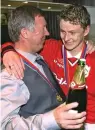  ??  ?? Role model: Solskjaer with Ferguson in 1999