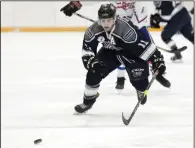  ?? NEWS PHOTO RYAN MCCRACKEN ?? Medicine Hat Travelodge Cubs forward Tristan Stensrud chases down a loose puck during the first period of Saturday’s Heritage Junior Hockey League game against the Mountainvi­ew Colts at the Kinpex.