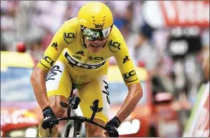  ?? PHILIPPE LOPEZ/AFP ?? Chris Froome, in the overall leader’s yellow jersey crosses the finish line at the end of stage 12 of the 104th Tour de France on Saturday.