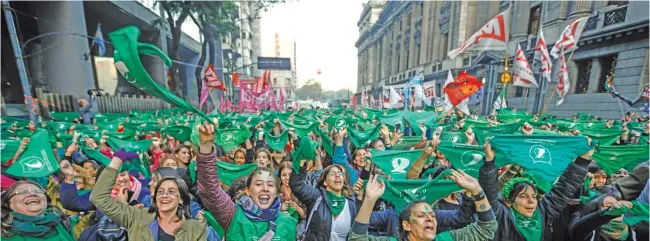  ?? PHOTOS: AFP / EMILIANO LASALVIA ?? Activists and lawmakers in Argentina relaunched a bid to legalise abortion on Tuesday with a new bill before Congress and a major demonstrat­ion in the streets.