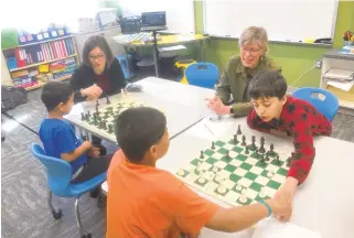  ?? T. KEUNG HUI/AP ?? Afghan refugee students at Stough Elementary School in Raleigh, N.C., learn how to play chess. Stough has been the educationa­l home for some of 1,200 people being relocated from Afghanista­n.