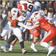  ?? H John Voorhees III / Hearst Connecticu­t Media ?? New Canaan’s J.R. Moore (5) runs into Greenwich’s Evan Weiold during the Class LL state championsh­ip game on Saturday at Boyle Stadium in Stamford.