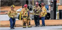  ??  ?? A hazmat team was called to assist in cleaning up the results of a fuel tanker crash that spilled thousands of gallons of gasoline into a storm drain at the busy intersecti­on in Gwinnett County.