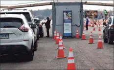  ?? Dan Haar/Hearst Connecticu­t Media ?? Community Health Center Inc. opened the state’s first and largest large-scale outdoor COVID-19 vaccinatio­n clinic Sunday, Jan. 17, on a runway at Rentschler Field in East Hartford.