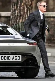  ??  ?? Licence To Thrill: Princess Eugenie, top, gets in 190mph Aston Martin, driven by Daniel Craig, above, in Spectre